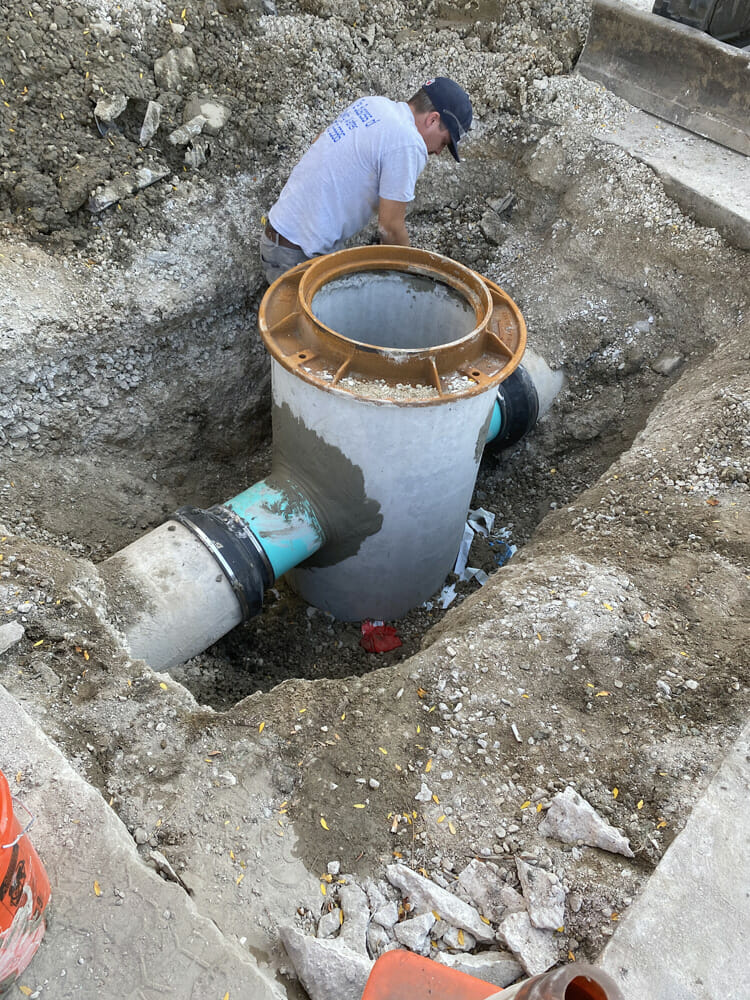 replacement of stormwater drainage manhole in parking lot do to sinkage around the rim 18 inch pipe Joliet, IL